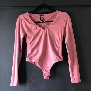 Pink nylon body suit